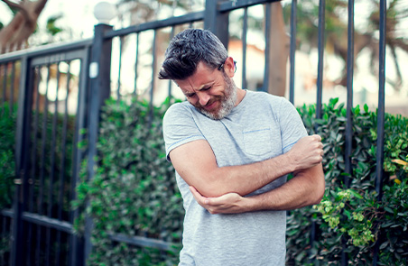 Man suffering from Tennis Elbow